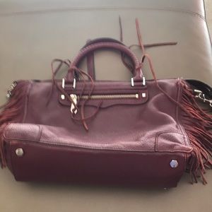 Well-worn Rebecca Minkoff burgundy bag w/fringe 12 1/2 X 9inches 6”bottom depth